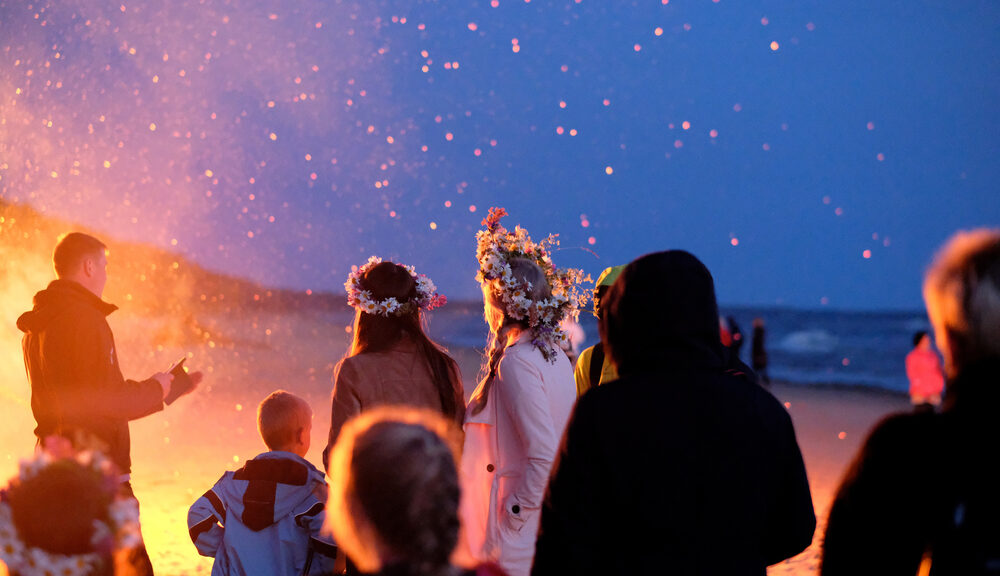 solstice neopagans celebrating by fire at night